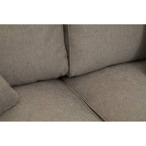 Close-up view of the Valensole 2 Seat Grey Sofa, highlighting the soft, textured fabric and the plush cushions that provide comfort. The neutral grey color complements various interior styles, and the seams are neatly finished, showcasing quality craftsmanship