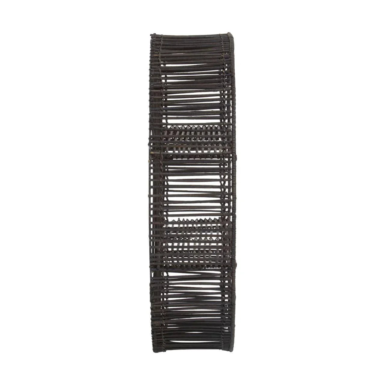 Narrow brown rattan wall shelf with open weave design and three compartments