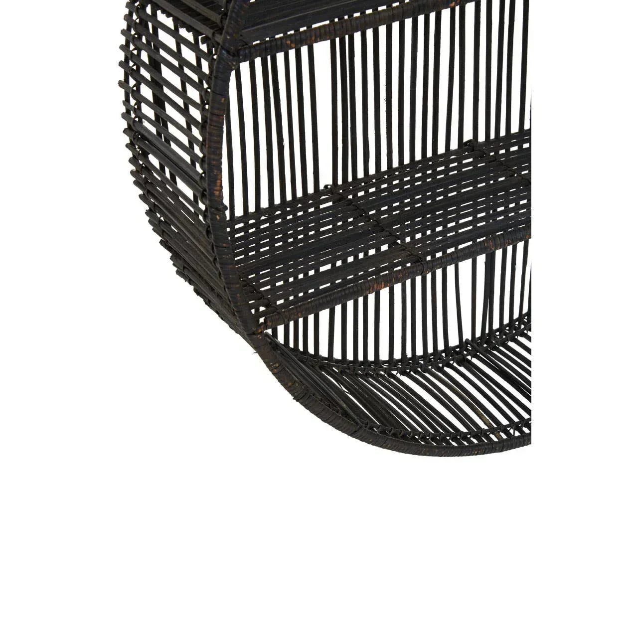 Close view of round black rattan wall shelf with open weave design