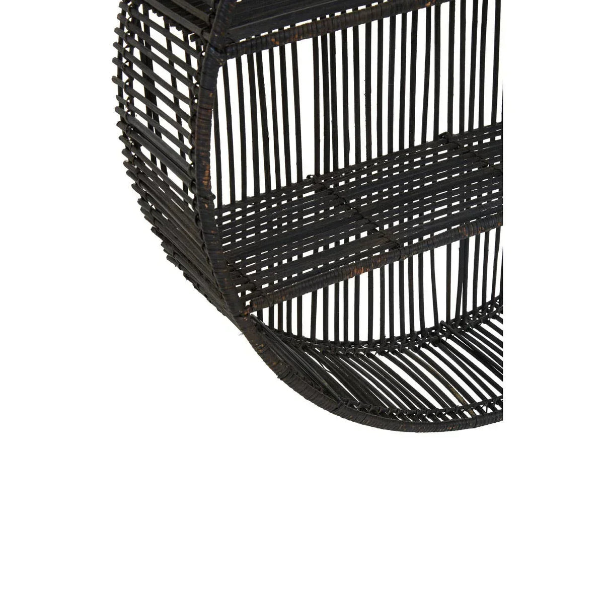 Close view of round black rattan wall shelf with open weave design
