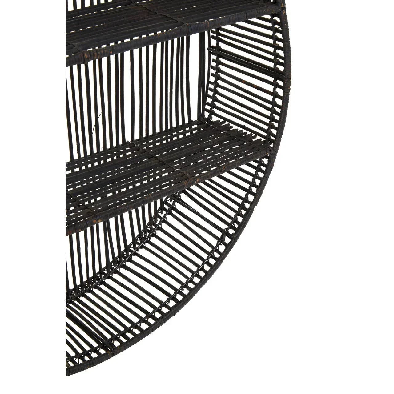 Close up of round black rattan wall shelf with two shelves and open slatted design