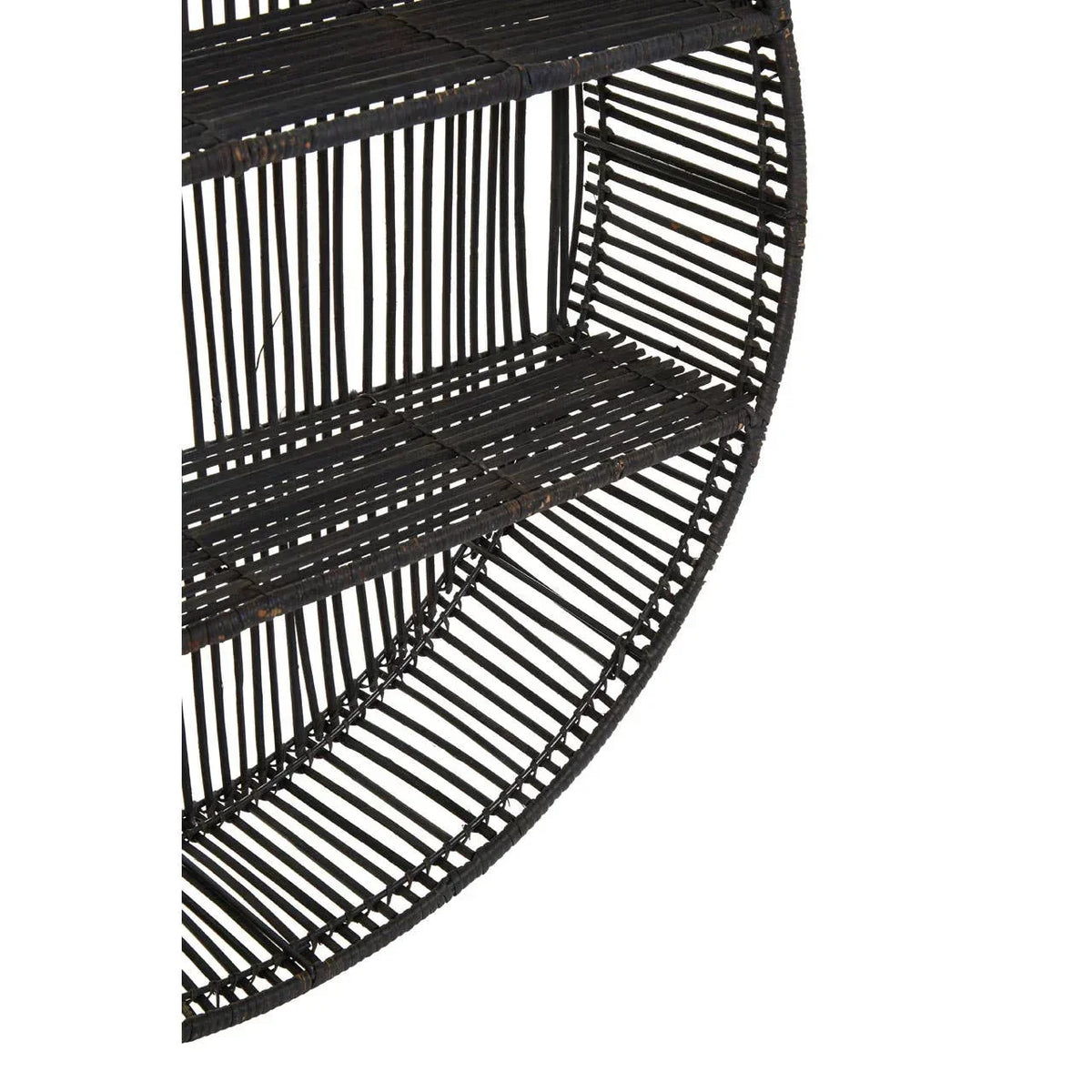 Close up of round black rattan wall shelf with two shelves and open slatted design
