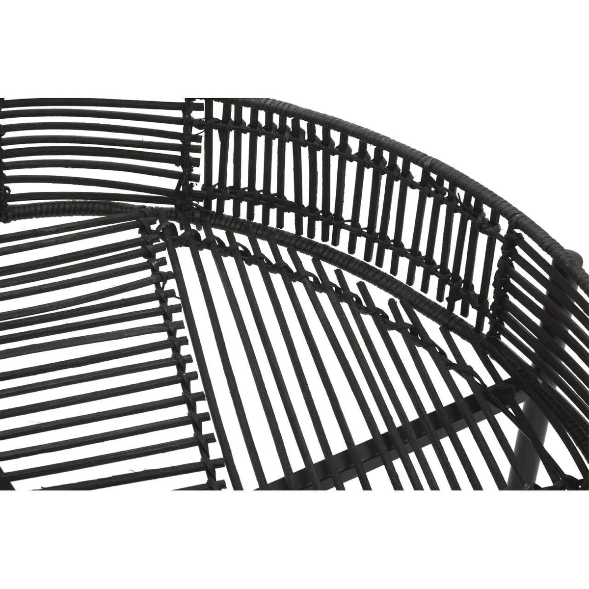 Close-up of black rattan chair frame detailing with curved backrest