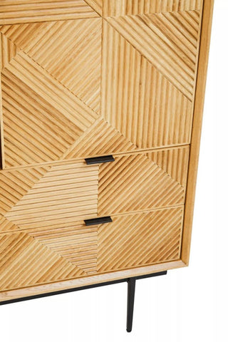 Natural finish cabinet featuring a geometric pattern on the front, two drawers with sleek black handles, and slender black legs for support