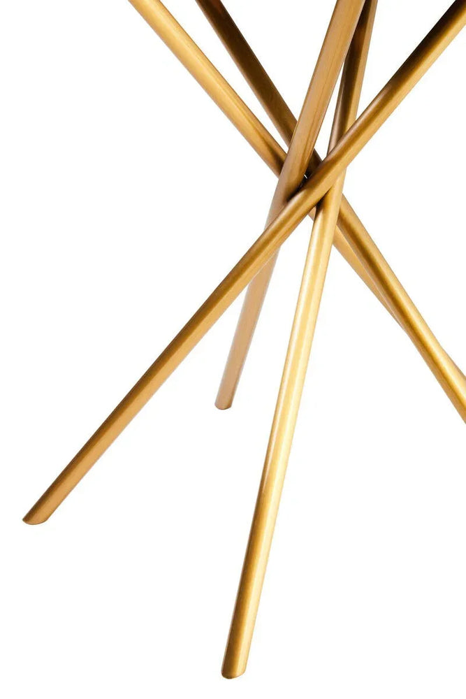 Gold metal table legs in intersecting design, close view on white background