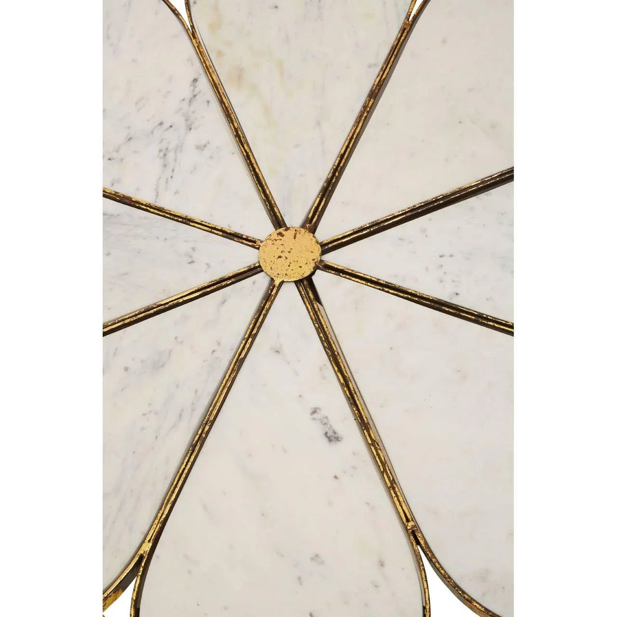 Marble wall decor with gold metal spokes in a geometric petal design, close-up view