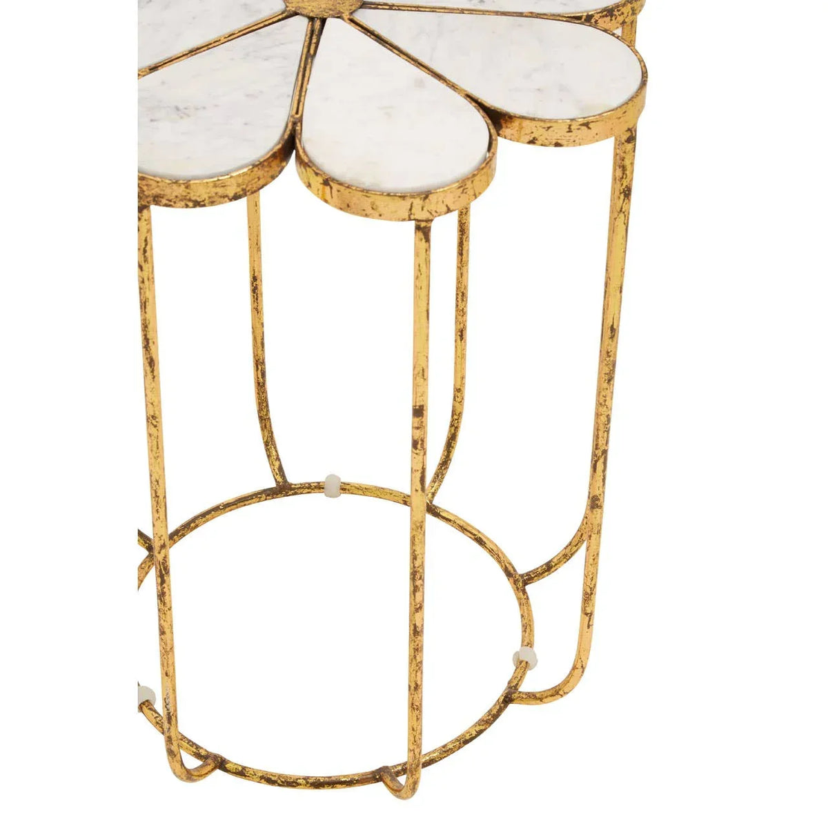 Gold metal side table with white marble top, floral petal design, close-up view