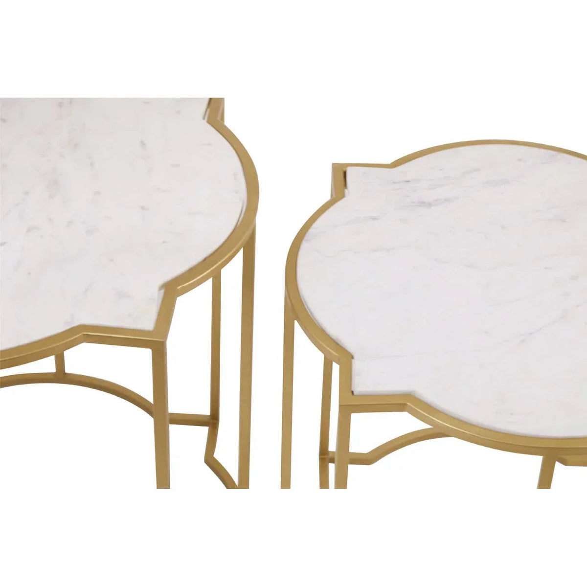 White marble top nesting tables with gold metal frames, close-up view