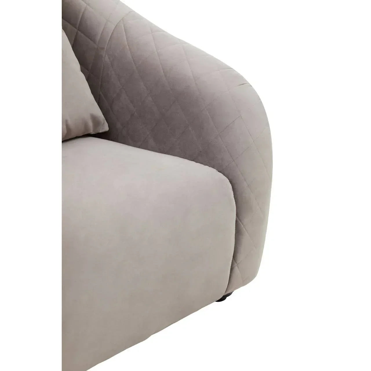 Close-up of light grey fabric sofa armrest with quilted stitching detail