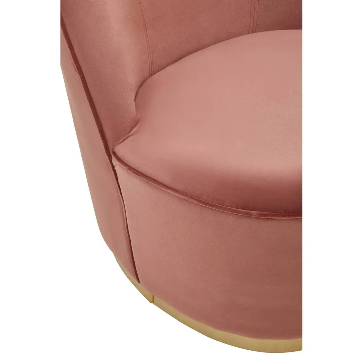 Close view of pink velvet accent chair seat with curved back and gold base detail