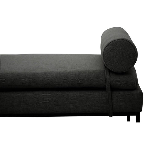 Dark grey chaise lounge with cylindrical bolster cushion and metal legs, side view