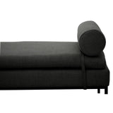 Dark grey chaise lounge with cylindrical bolster cushion and metal legs, side view