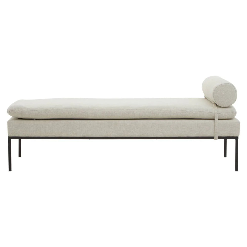 Cream upholstered bench with slim metal legs and cylindrical bolster cushion