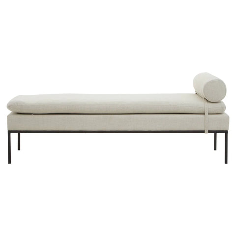 Cream upholstered bench with slim metal legs and cylindrical bolster cushion