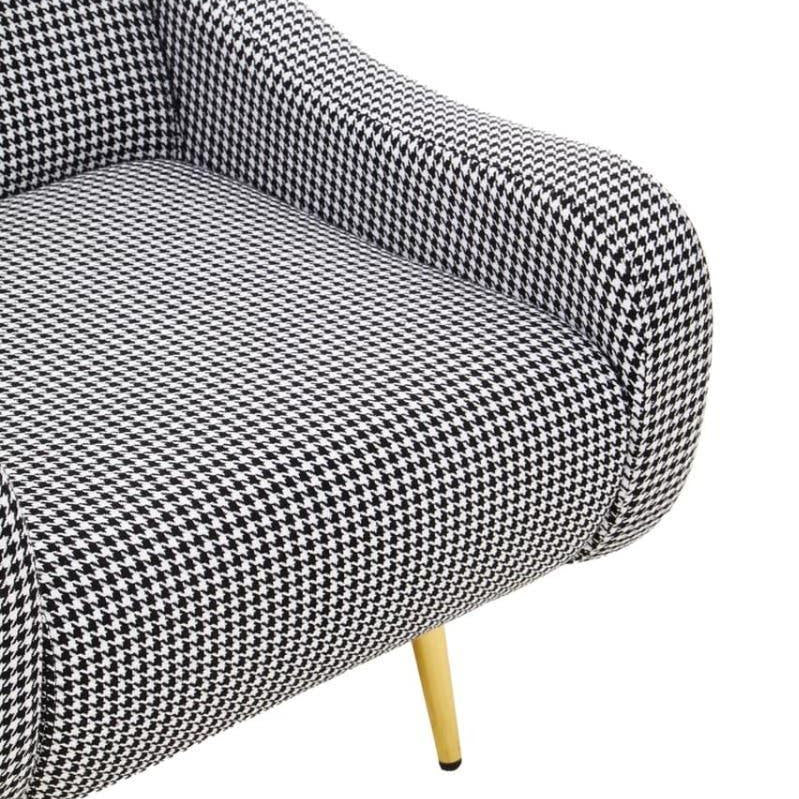 Houndstooth accent chair with yellow wooden legs, close up of padded seat and armrest
