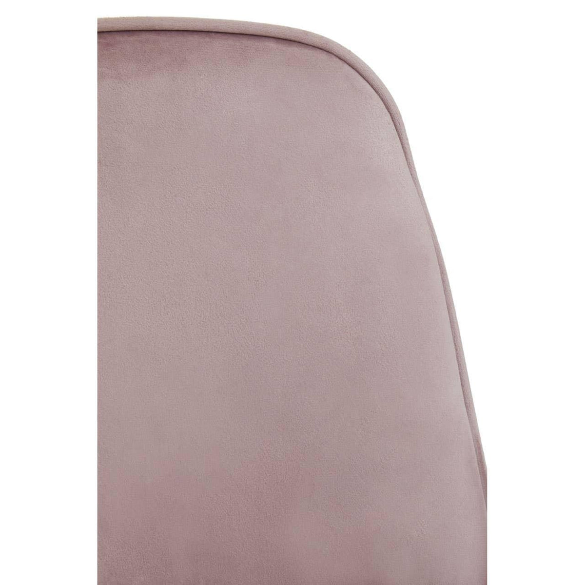 Closeup of pink velvet chair backrest with rounded edge detail