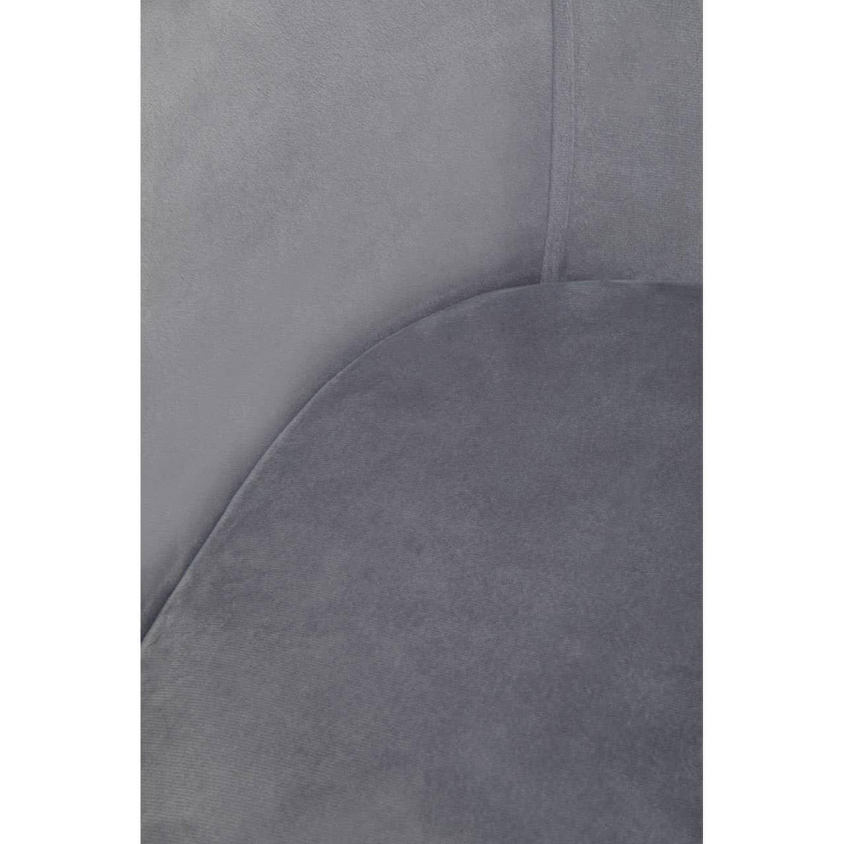 Close-up of grey velvet armchair fabric and stitching detail
