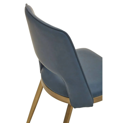 Blue faux leather dining chair with curved backrest and gold legs, rear angle view