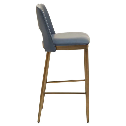 Blue bar stool with padded seat and backrest, brass metal legs, side angle view