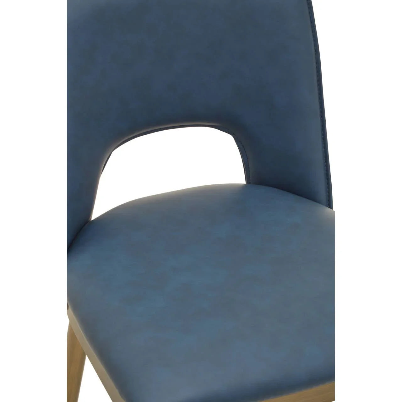 Blue faux leather dining chair with cut-out backrest and wooden legs, close-up view