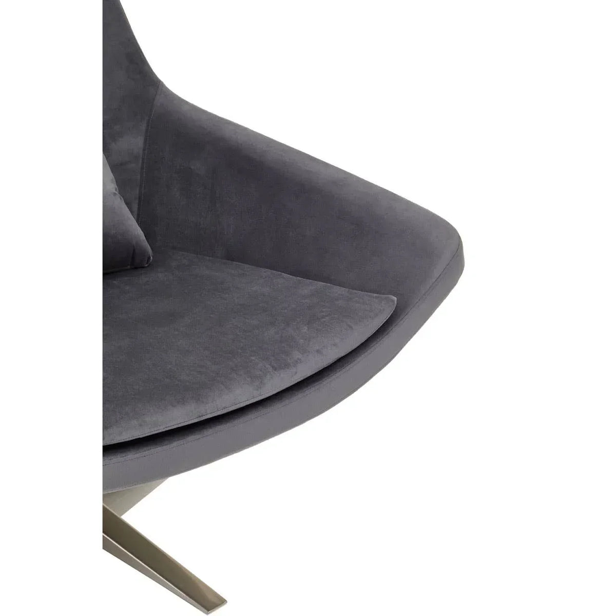 Closeup of grey velvet armchair seat with brushed metal leg base