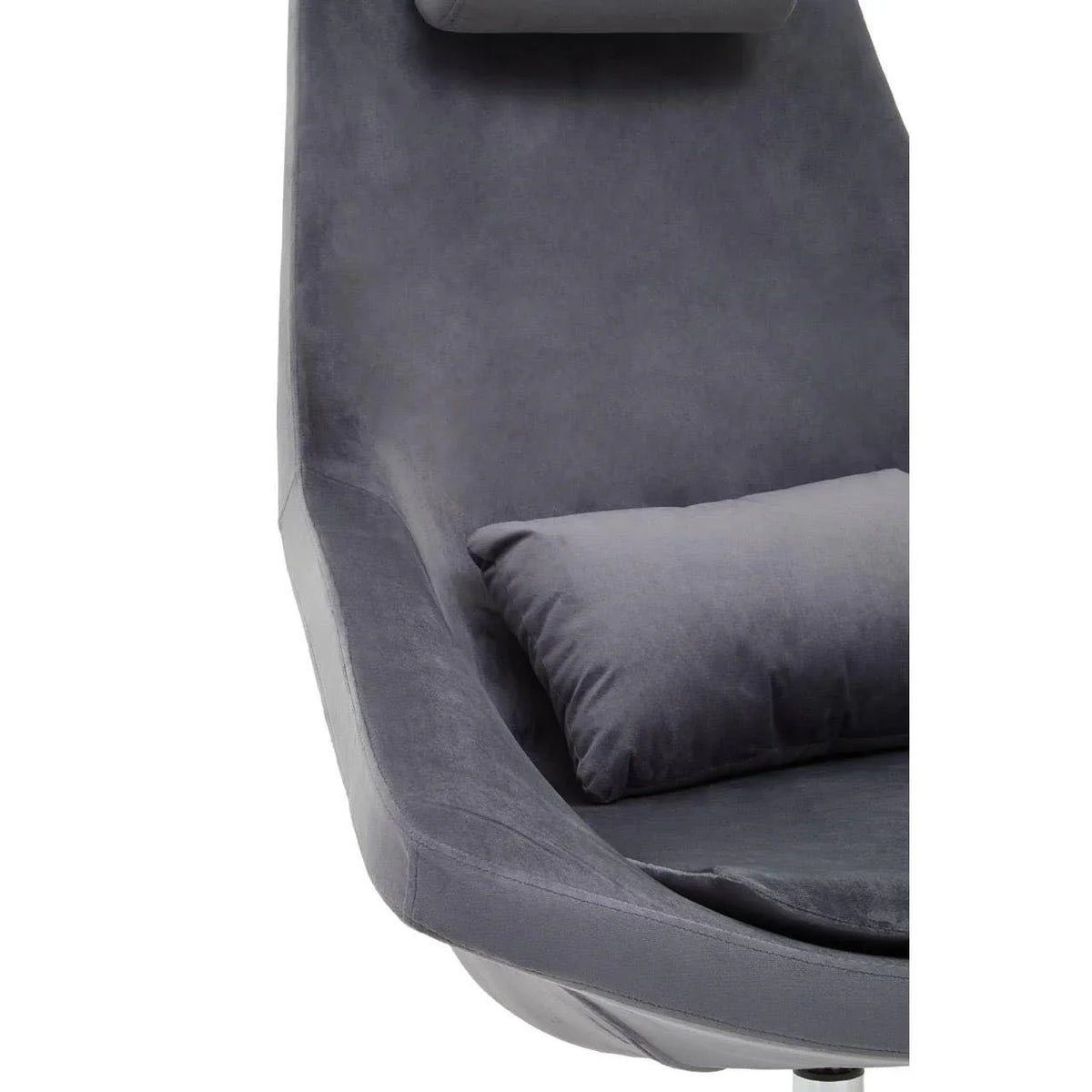 Closeup of grey velvet armchair with matching cushion and padded headrest