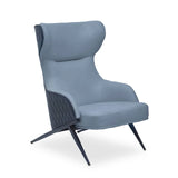 Blue accent chair with wingback design and quilted sides on angled metal legs