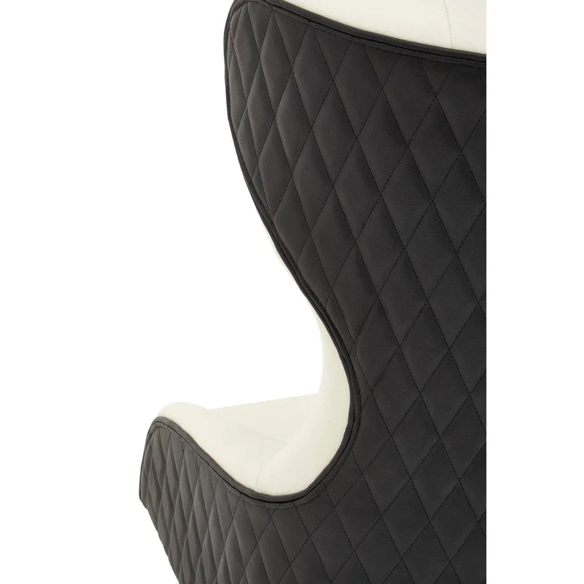 Close up of black quilted armchair with white seat upholstery, side view