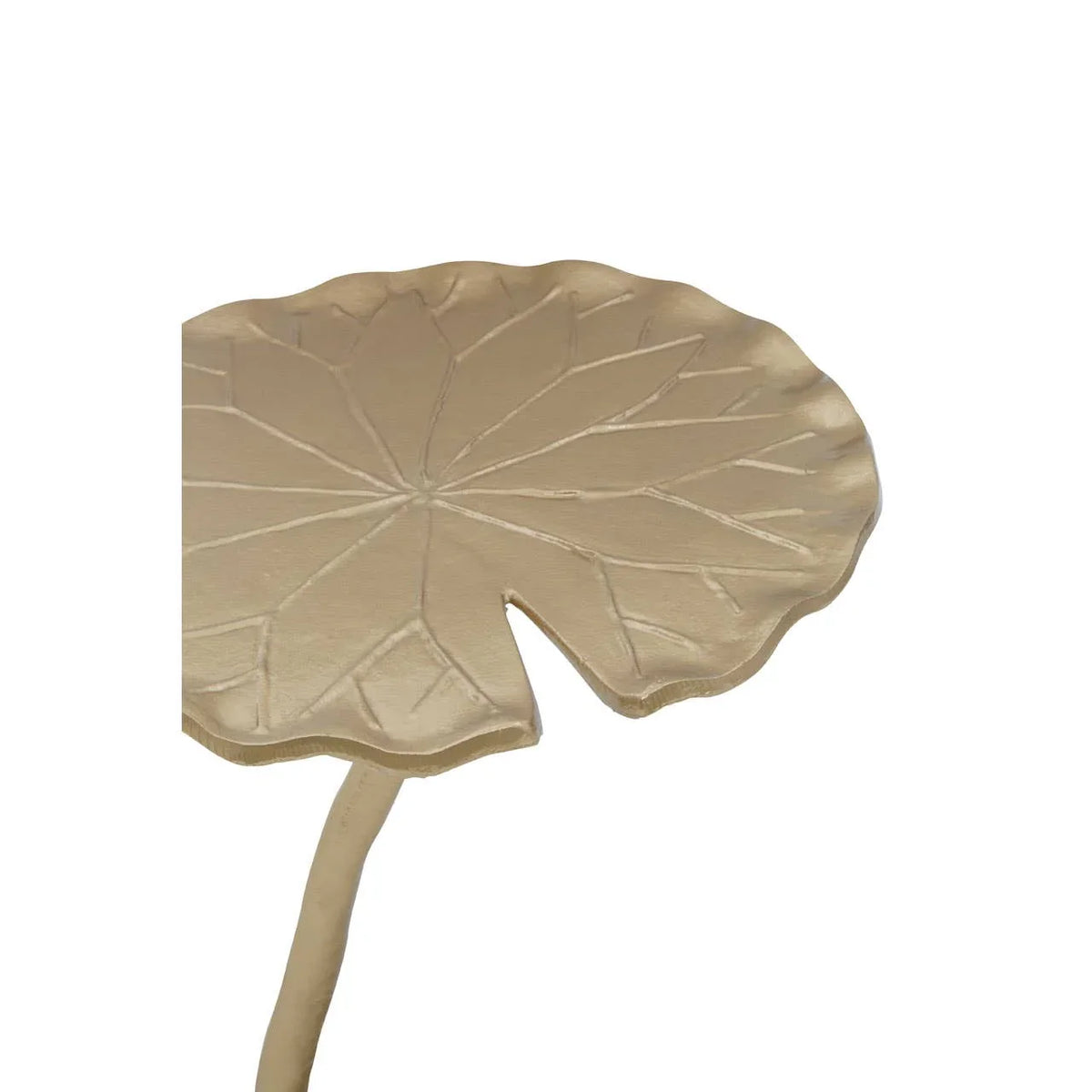 Gold metal side table top shaped like a leaf with engraved vein details, close-up view