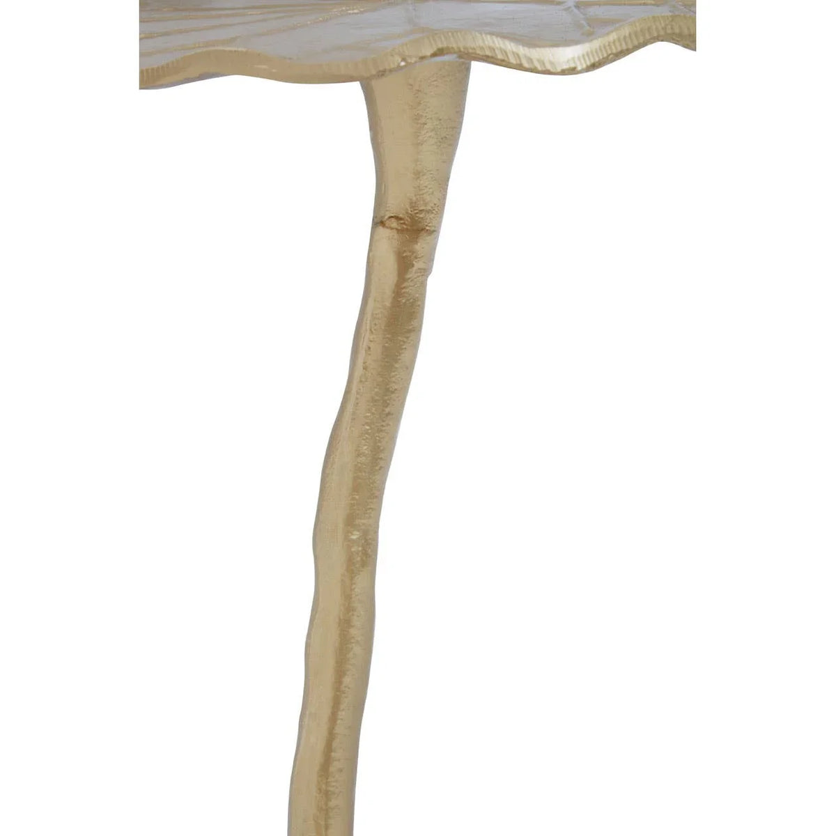 Gold metal side table with textured top and slender sculpted leg detail
