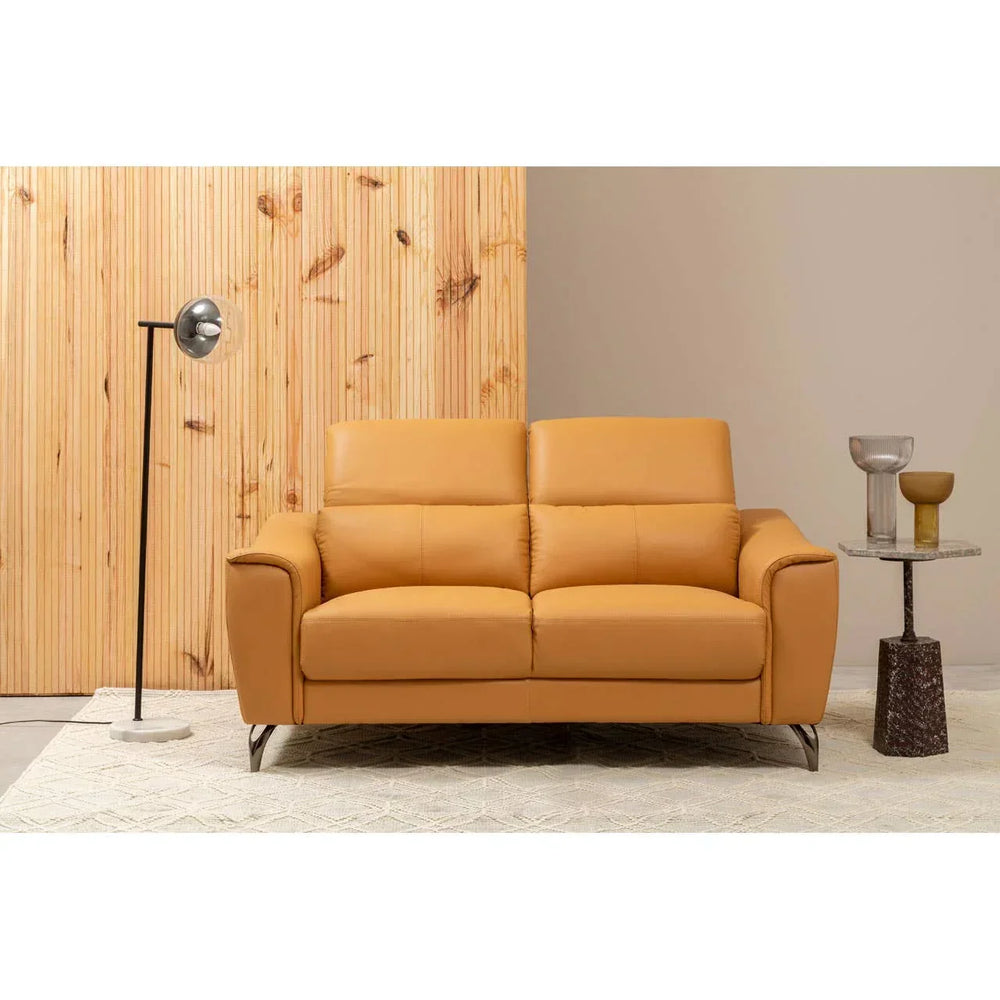 Mustard yellow leather sofa with metal legs in modern living room setting