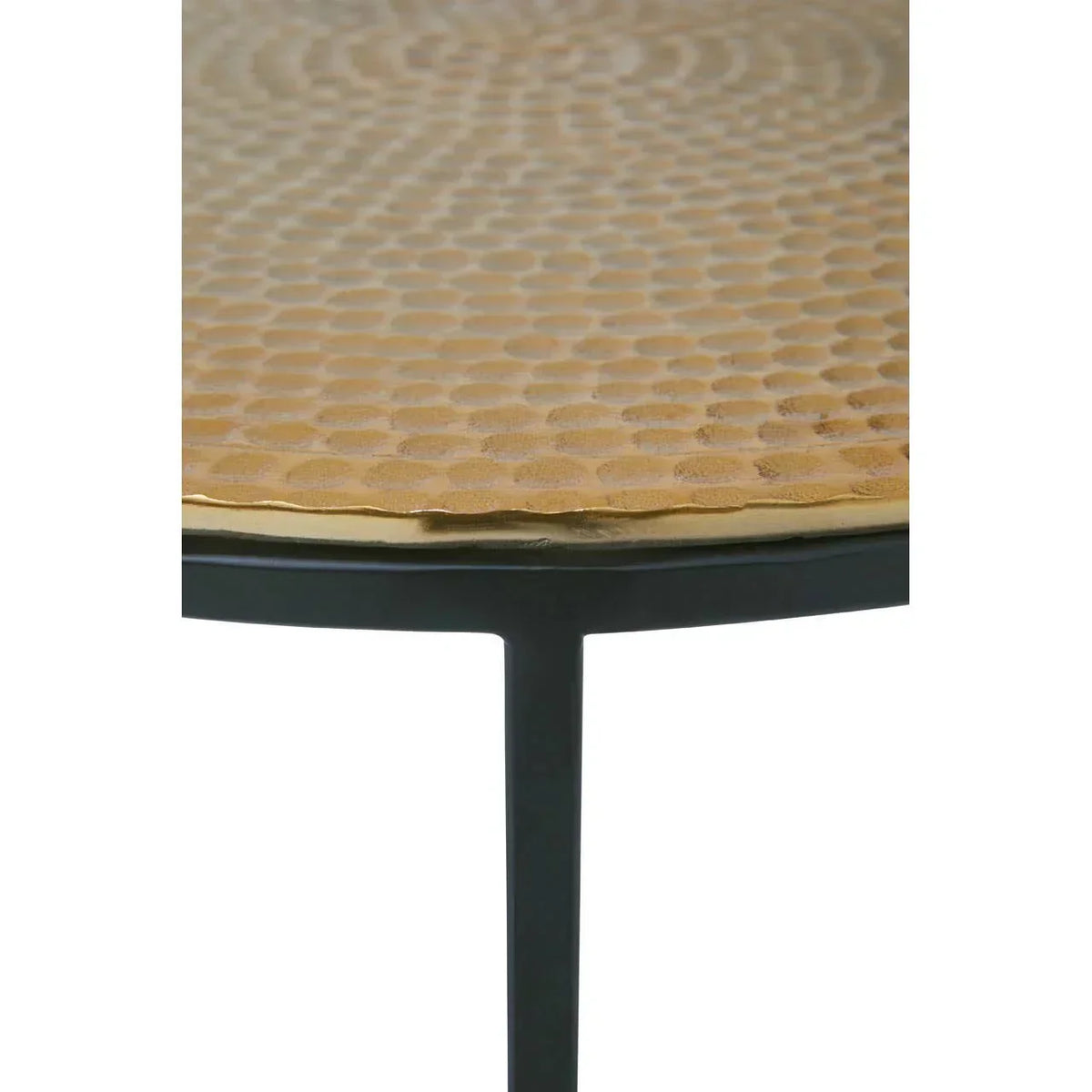 Round metal coffee table with hammered gold top and black frame close-up