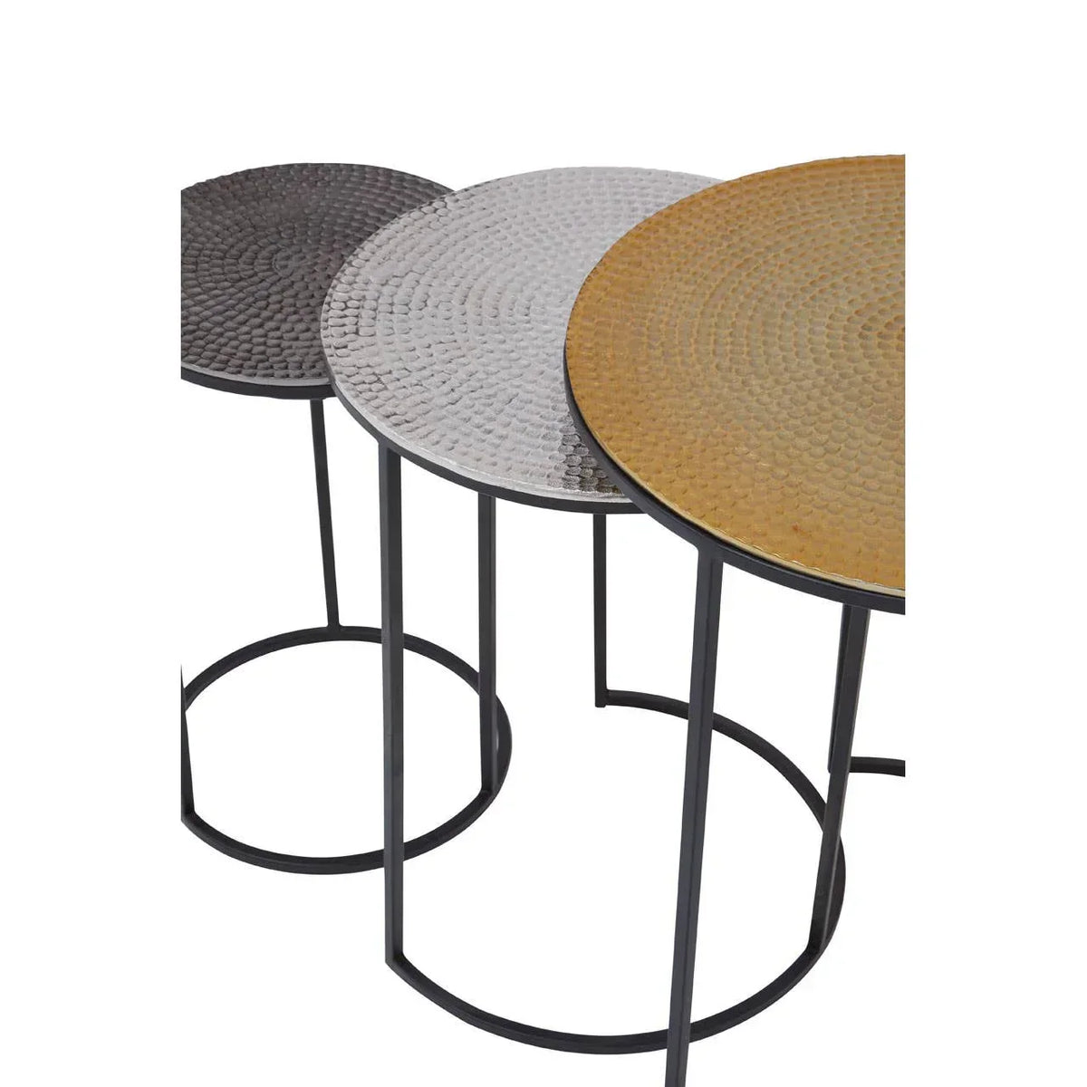 Set of three round metal nesting tables in gold, silver, and black with textured tops