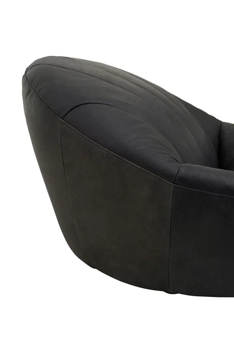 Curved black fabric armrest detail on modern lounge chair