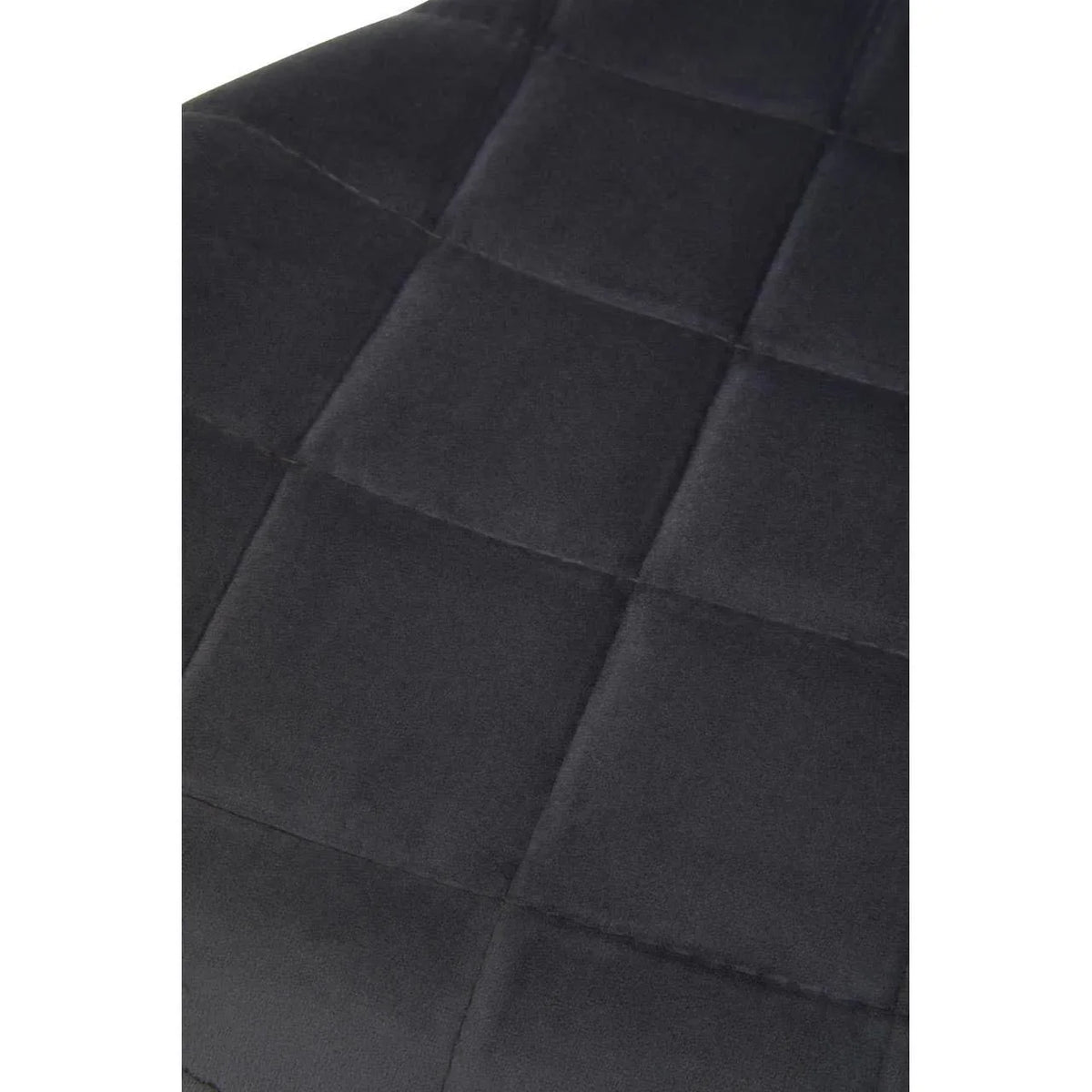 Close-up of charcoal fabric dining chair with square stitched upholstery