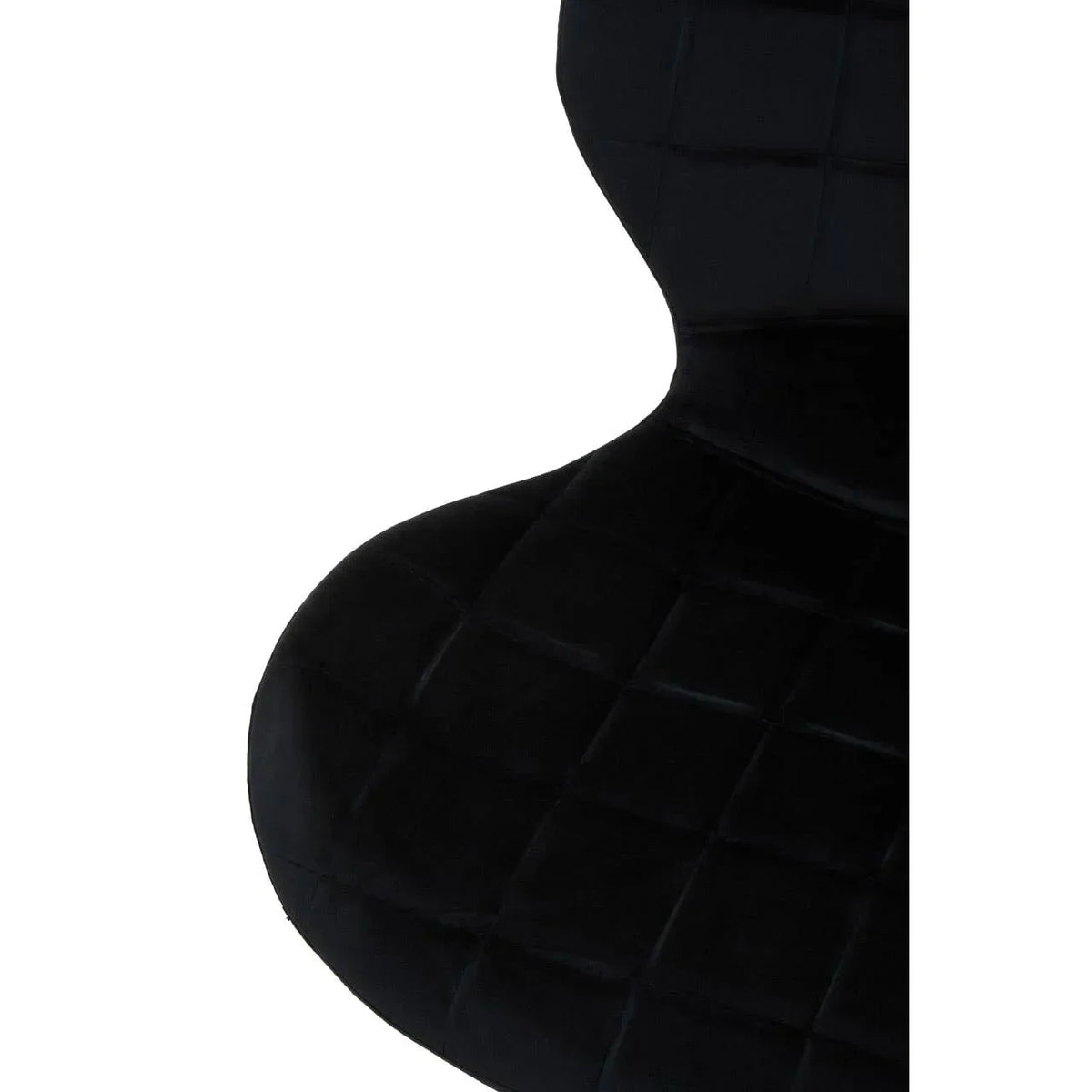 Black velvet dining chair with quilted seat and backrest close-up