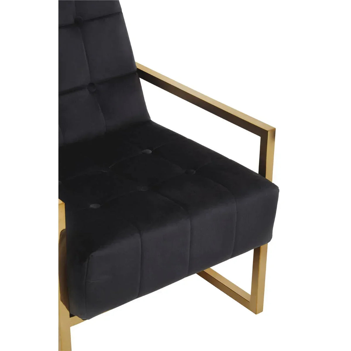 Black velvet accent chair with gold metal armrest and tufted seat detail