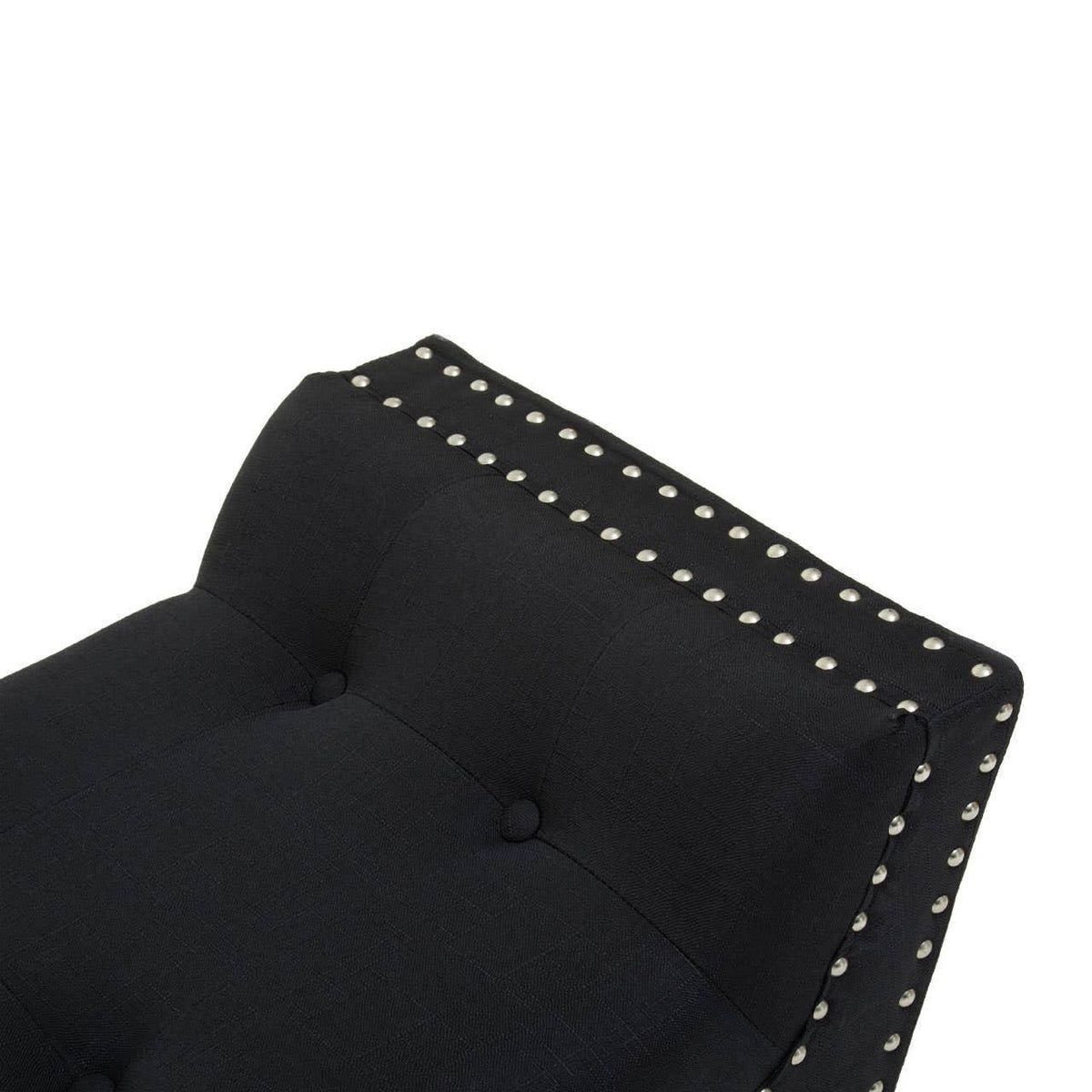Black upholstered chair backrest with button tufting and nailhead trim detail