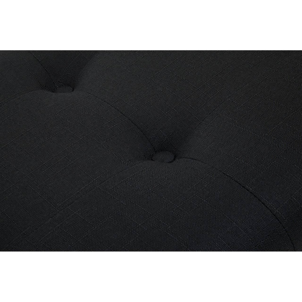 Close-up of black fabric sofa cushion with button-tufted detail