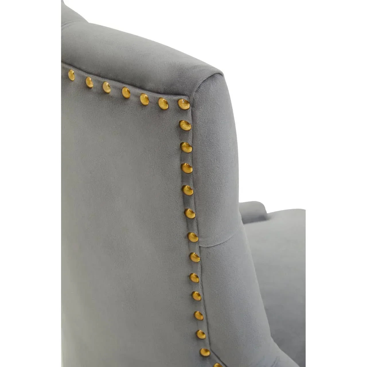 Grey upholstered chair back with gold stud detailing, close-up view of fabric and trim