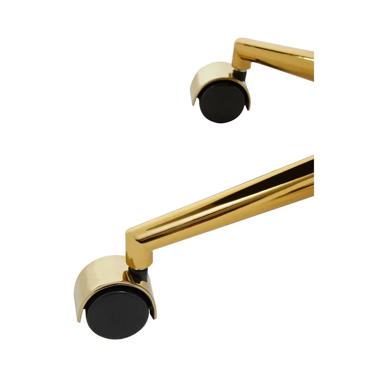 Gold metal furniture legs with black caster wheels close-up