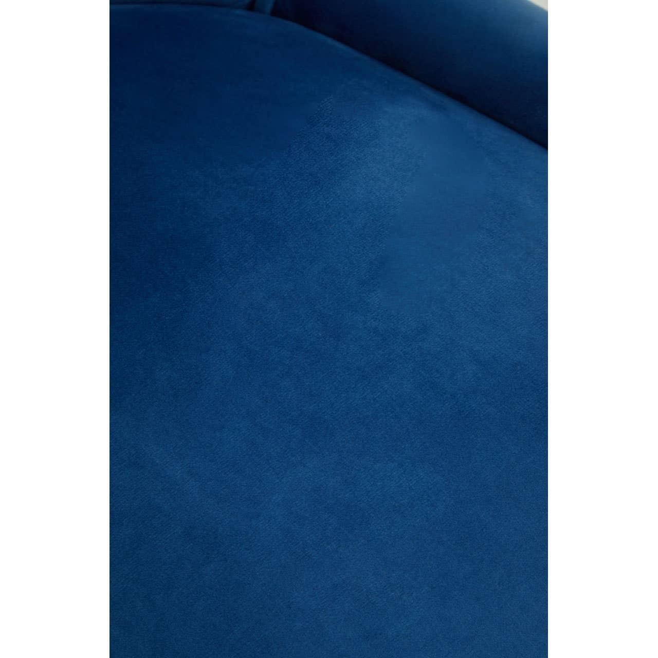 Close-up of blue velvet sofa upholstery with smooth texture