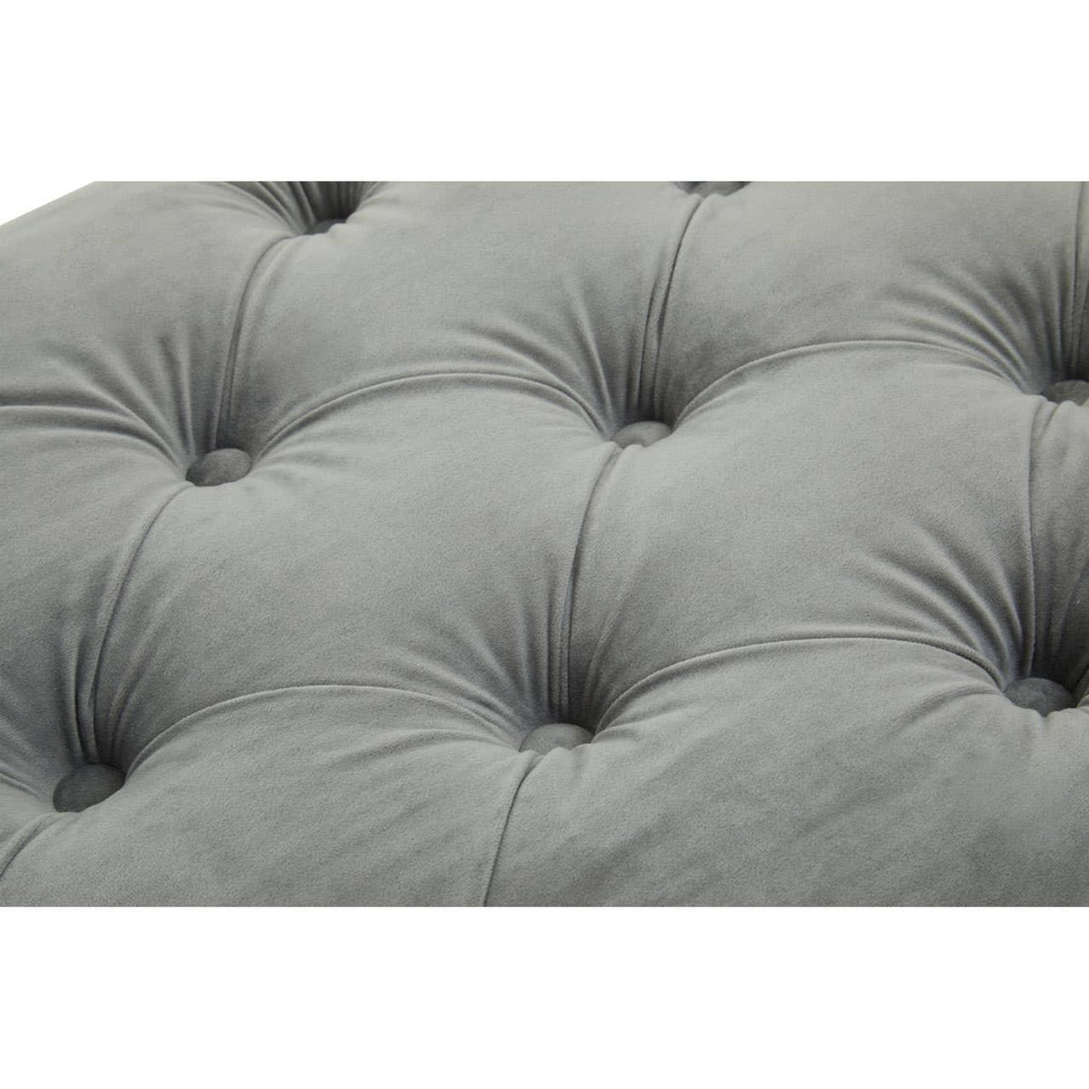 Close-up of grey fabric tufted sofa cushion with button detail