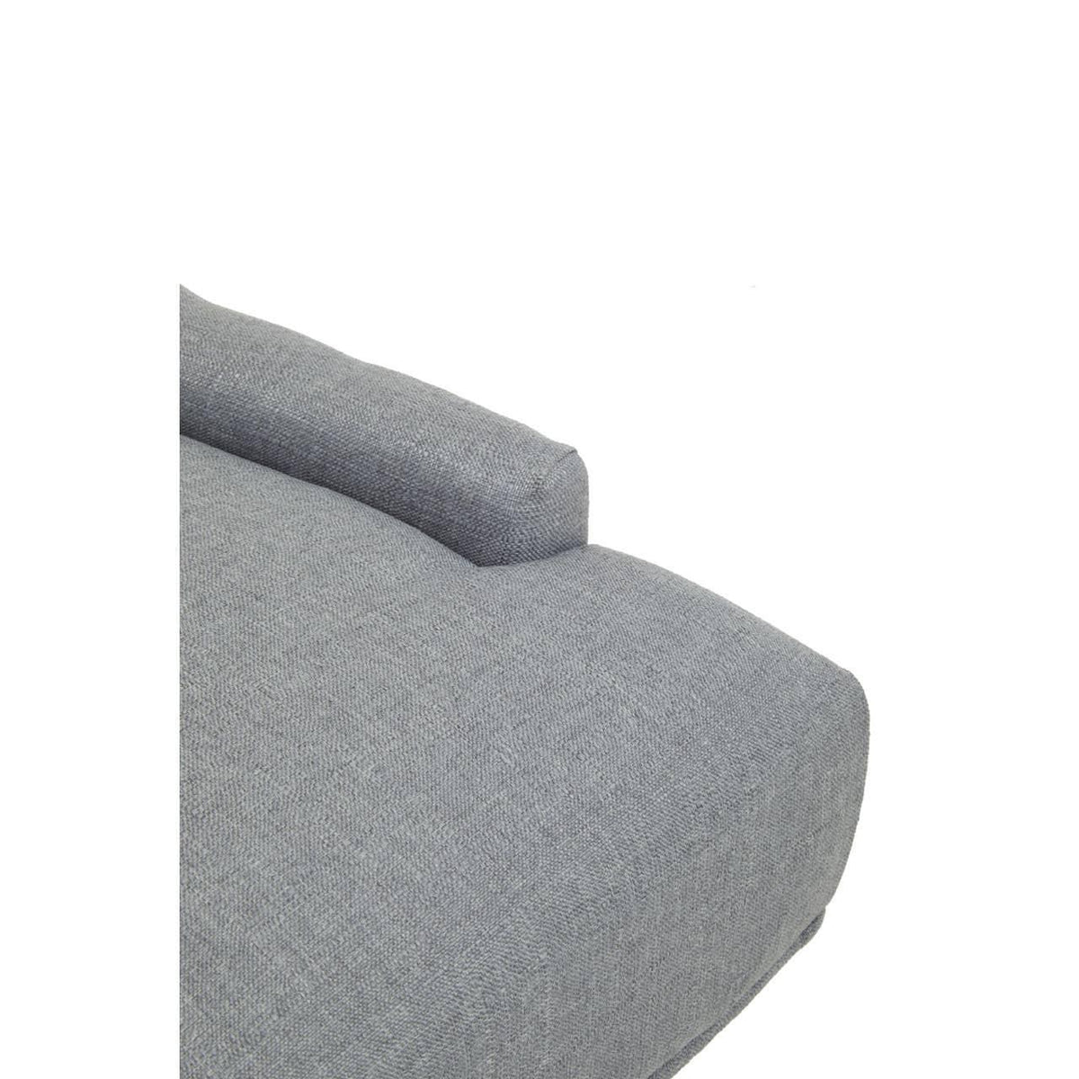 Close-up of grey fabric sofa armrest and seat cushion texture