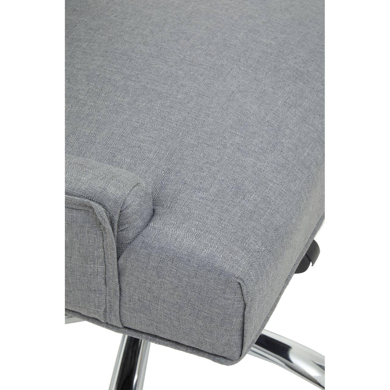 Close-up of grey fabric dining chair seat with chrome legs