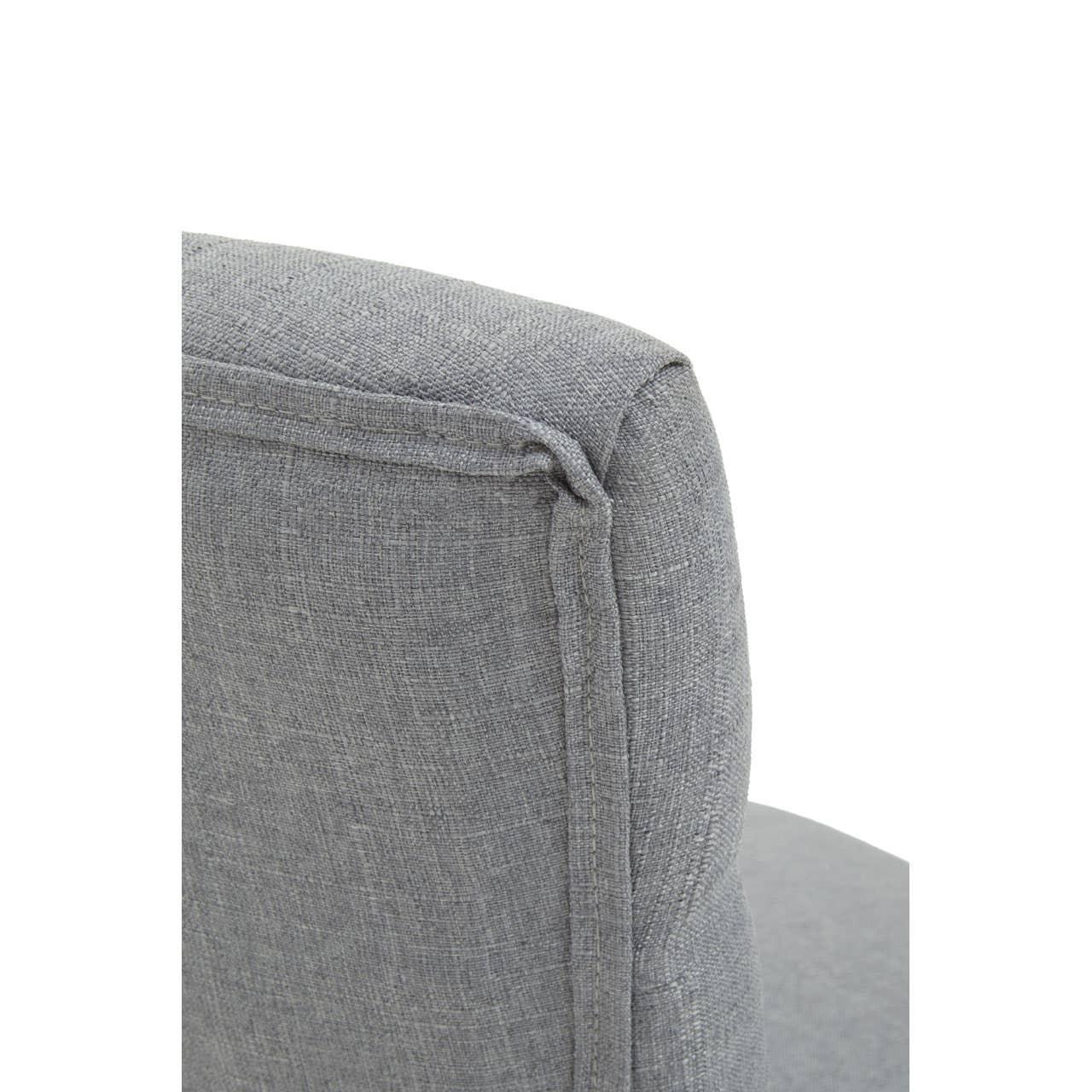 Close-up of grey fabric armchair backrest with visible stitching detail