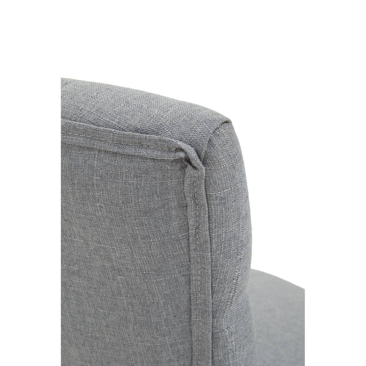 Close-up of grey fabric armchair backrest with visible stitching detail