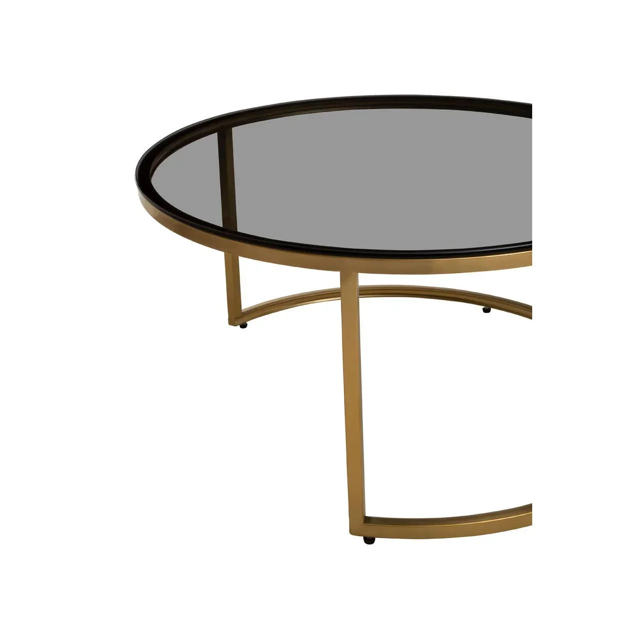 Round glass coffee table with gold metal frame, close view of leg and top detail