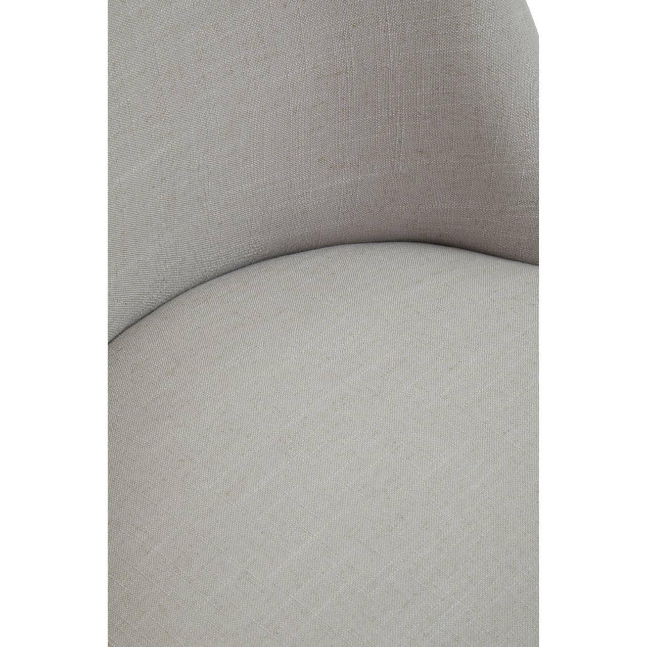 Closeup of light grey fabric armchair seat and curved backrest detail