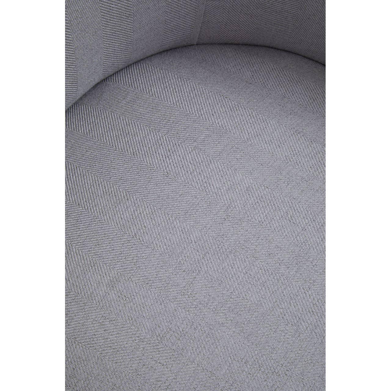 Close up of light grey fabric armchair seat with herringbone pattern upholstery